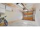 A clean and functional garage with overhead storage and a bicycle at 1650 Bedivere Cir, Lafayette, CO 80026