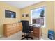 Home office space featuring a desk, comfortable chair, and natural light from a large window at 1650 Bedivere Cir, Lafayette, CO 80026