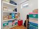 The storage room includes a shelving unit for ample storage at 1650 Bedivere Cir, Lafayette, CO 80026