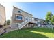 Exterior view of the house with a backyard and patio area at 21383 E Smoky Hill Rd, Centennial, CO 80015