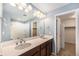 Bathroom with double sinks, modern lighting, and shower-tub combo at 21383 E Smoky Hill Rd, Centennial, CO 80015