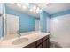 Bathroom featuring a vanity, lighting, and shower-tub combination at 21383 E Smoky Hill Rd, Centennial, CO 80015