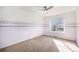 Bedroom with a large window providing natural light and scenic views at 21383 E Smoky Hill Rd, Centennial, CO 80015