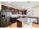 Kitchen with granite countertops, stainless steel appliances, and wood flooring at 21383 E Smoky Hill Rd, Centennial, CO 80015