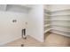 Convenient laundry room with tile flooring and ample storage space at 21383 E Smoky Hill Rd, Centennial, CO 80015