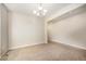 Carpeted living room with neutral paint, bright light, and open access to other rooms at 21383 E Smoky Hill Rd, Centennial, CO 80015
