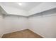 Walk-in closet with built-in shelving and ample storage space at 21383 E Smoky Hill Rd, Centennial, CO 80015
