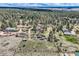 Beautiful aerial view of a home surrounded by dense trees, showcasing the property's privacy and natural beauty at 7715 Rafter Rd, Franktown, CO 80116