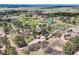 This aerial image shows the property, outbuildings, and the surrounding rural neighborhood at 7715 Rafter Rd, Franktown, CO 80116