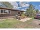 Features a patio area, grill, outdoor seating, and scenic backyard at 7715 Rafter Rd, Franktown, CO 80116