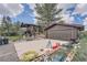 The exterior features a 2-car garage, spacious driveway, and landscaped front yard at 7715 Rafter Rd, Franktown, CO 80116