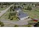 Gorgeous aerial view of this home featuring lush landscaping, mature trees, and an oversized lot at 34544 Columbine W Trl, Elizabeth, CO 80107