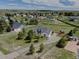 Lovely aerial view of the home, detached garage, surrounding property and neighborhood at 34544 Columbine W Trl, Elizabeth, CO 80107