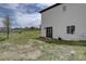 Home backyard featuring a patio area and a big grassy area at 34544 Columbine W Trl, Elizabeth, CO 80107