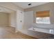 Modern bathroom featuring white tile, shower, soaking tub, and neutral color scheme at 34544 Columbine W Trl, Elizabeth, CO 80107
