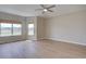 Large bedroom with a ceiling fan and two windows overlooking the neighborhood at 34544 Columbine W Trl, Elizabeth, CO 80107