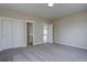 Spacious bedroom with neutral walls, plush carpet, and ample closet space at 34544 Columbine W Trl, Elizabeth, CO 80107