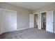 Bedroom features a closet and two doorways to the ensuite bathroom and hallway at 34544 Columbine W Trl, Elizabeth, CO 80107