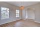 Bright dining room with wood floors, stylish light fixture, and large windows providing natural light at 34544 Columbine W Trl, Elizabeth, CO 80107