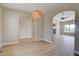 Open floor plan with hardwood floors, archways, and inviting lighting at 34544 Columbine W Trl, Elizabeth, CO 80107
