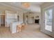 Inviting living space with fireplace, kitchen, and ample natural light at 34544 Columbine W Trl, Elizabeth, CO 80107