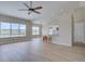 Open living area with fireplace, kitchen bar, and lots of natural light at 34544 Columbine W Trl, Elizabeth, CO 80107