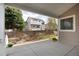 Covered back patio with views of the fenced yard at 9640 Sydney Ln, Highlands Ranch, CO 80130