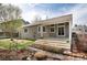 Exterior backyard view highlighting the home's siding and covered patio at 9640 Sydney Ln, Highlands Ranch, CO 80130