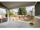 Relaxing covered patio with a beautiful tree lined backyard and privacy fence at 9640 Sydney Ln, Highlands Ranch, CO 80130