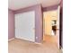 Bedroom with a closet featuring sliding doors and entry way to the hallway at 9640 Sydney Ln, Highlands Ranch, CO 80130