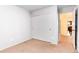 Clean bedroom with neutral carpet, a sliding closet door, and a view to the hallway at 9640 Sydney Ln, Highlands Ranch, CO 80130