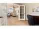 View from the office doorway into the living room of the home at 9640 Sydney Ln, Highlands Ranch, CO 80130