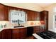 Gourmet kitchen with custom cabinets, granite countertops, and stainless steel appliances showcases luxury at 9640 Sydney Ln, Highlands Ranch, CO 80130