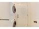 Laundry area with a full sized washer and dryer unit, and utility door at 9640 Sydney Ln, Highlands Ranch, CO 80130