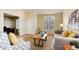 Bright living room featuring a large window, neutral paint, and comfortable seating at 9640 Sydney Ln, Highlands Ranch, CO 80130