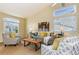 Open living room featuring vaulted ceilings and large windows with natural light at 9640 Sydney Ln, Highlands Ranch, CO 80130