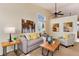 Bright living room featuring a comfortable sofa, stylish decor, and lots of natural light at 9640 Sydney Ln, Highlands Ranch, CO 80130