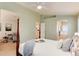 Serene main bedroom featuring a four-poster bed and archways to the bathroom at 9640 Sydney Ln, Highlands Ranch, CO 80130