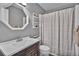 Functional bathroom featuring a vanity, toilet, shower, and neutral color scheme at 32187 Sylvan Rd, Golden, CO 80403