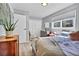 Comfortable bedroom with natural light, closet space, and minimalist decor at 32187 Sylvan Rd, Golden, CO 80403