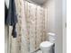 Functional bathroom with a shower featuring a relaxing patterned shower curtain at 1721 Wingfeather Ln, Castle Rock, CO 80108
