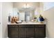 Bathroom vanity with modern fixtures, clean lines, and ample storage space for a stylish touch at 1721 Wingfeather Ln, Castle Rock, CO 80108