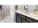 Stylish bathroom vanity features modern fixtures, white countertops, and dark wood cabinetry at 1721 Wingfeather Ln, Castle Rock, CO 80108