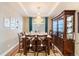 Dining room featuring chandelier, large table set for a meal, and hardwood flooring at 1721 Wingfeather Ln, Castle Rock, CO 80108
