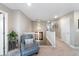 Upstairs hallway with chair, decor, and natural light at 1721 Wingfeather Ln, Castle Rock, CO 80108