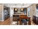 Spacious eat-in kitchen with stainless steel appliances, granite counters, and a central island at 1721 Wingfeather Ln, Castle Rock, CO 80108