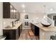 Kitchen features granite countertops, stainless steel appliances, and new flooring at 1721 Wingfeather Ln, Castle Rock, CO 80108