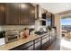 Well-equipped kitchen featuring granite countertops, stainless steel appliances, and ample cabinet space at 1721 Wingfeather Ln, Castle Rock, CO 80108
