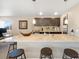 Modern kitchen features pendant lighting, stainless steel sink, and a spacious countertop with seating at 1721 Wingfeather Ln, Castle Rock, CO 80108