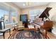 Living room with hardwood floors, ornate rug, and vintage decor at 1721 Wingfeather Ln, Castle Rock, CO 80108